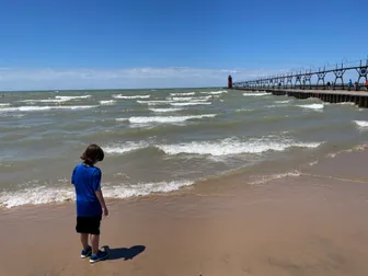 Beach with a lighthouse in the distance